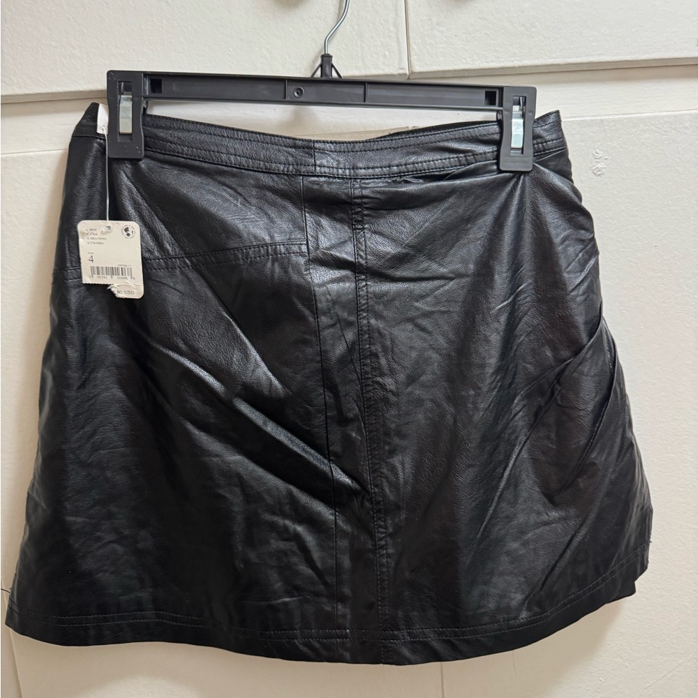 Black leather  skirt by free people never worn. Size 4
